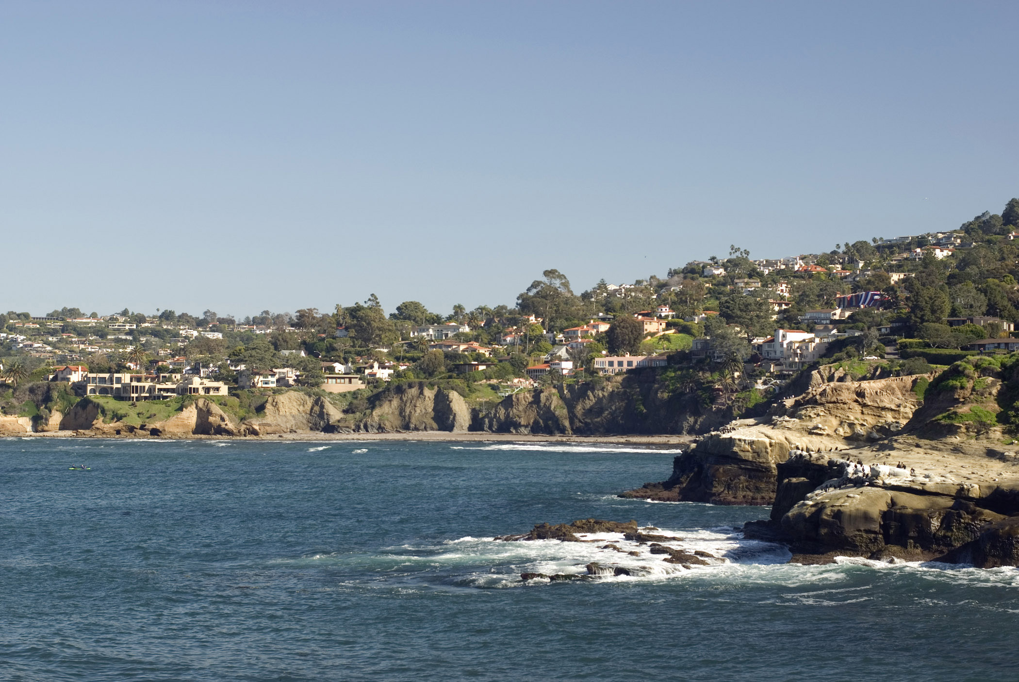 an image of Beautiful La Jolla Cove Beach in California on Gradient Light Blue Gray Sky Background. A Good Place for Unwind.
