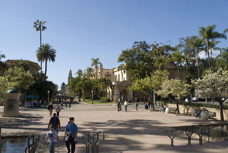 Random Tourists at Balboa Park San Diego. Captured with Trees and Buildings with Blue Sky Background.