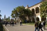 Random Tourists Hiking at Balboa Park San Diego. Captured with Architectural Buildings on Blue Sky Background.