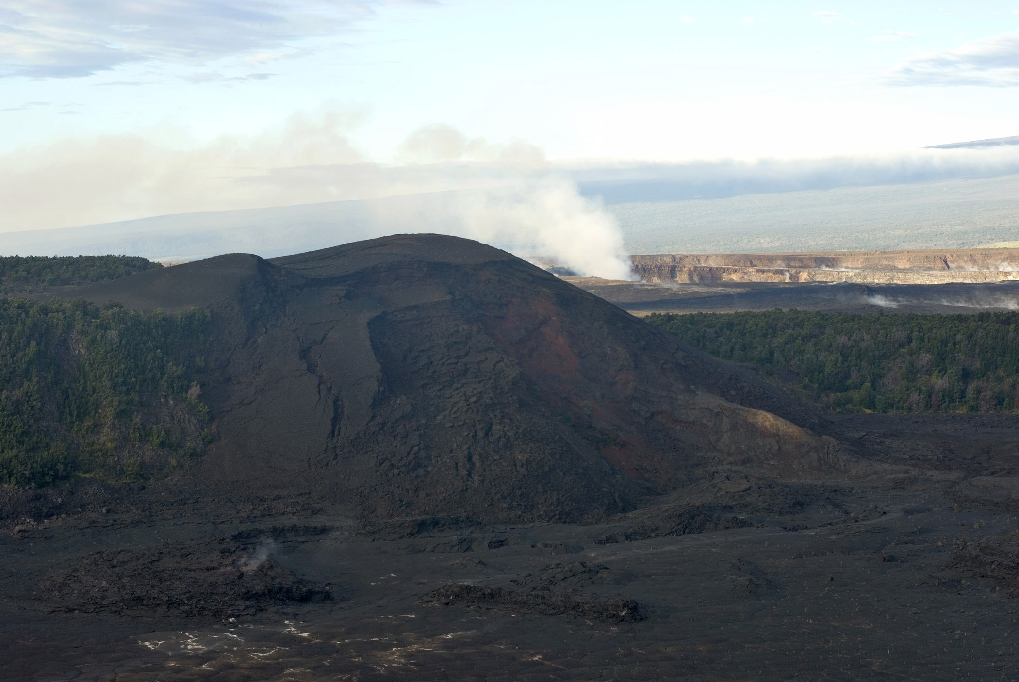 an image of Looking over the lava field and volcanic steam vent in the Kilauea Iki crater, Volcanoes National Park, Hawaii