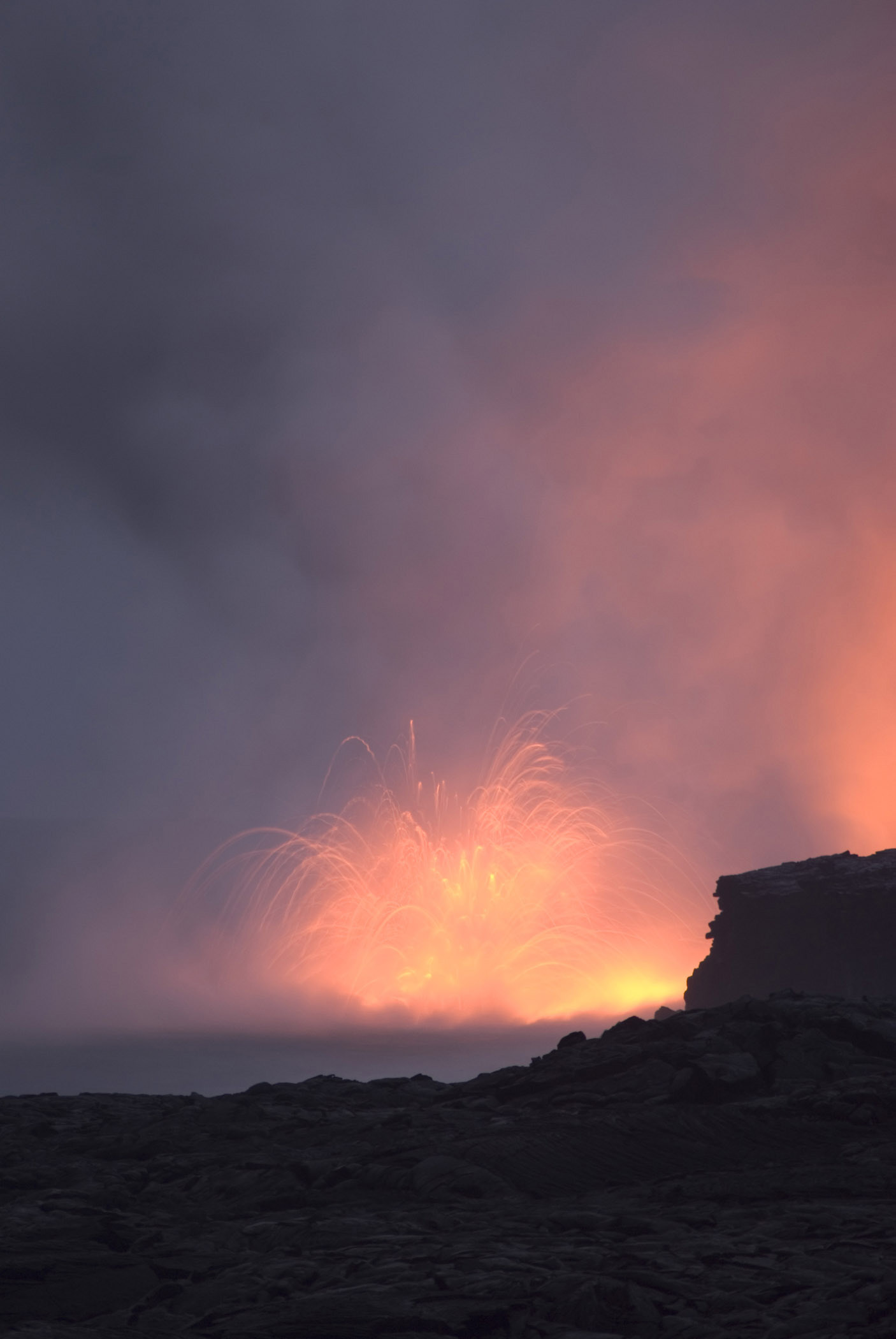 an image of Smoke From Red Hot Volcanic Lava Captured a Night.