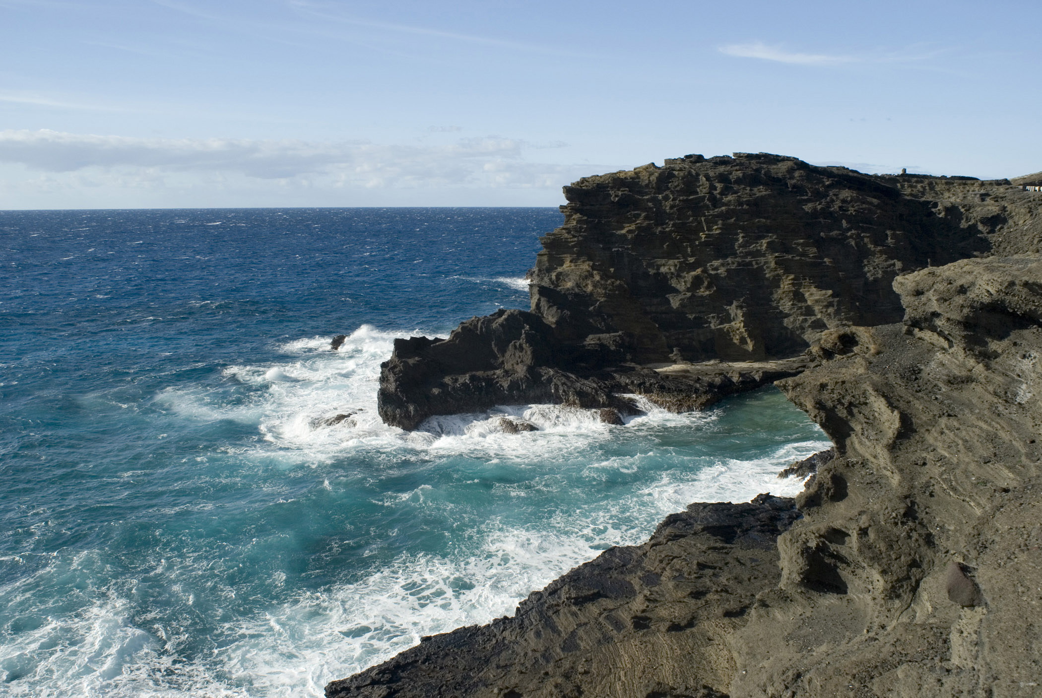 an image of Halona Blow Hole Rock Formation on Pacific Ocean in Oahu, Hawaii