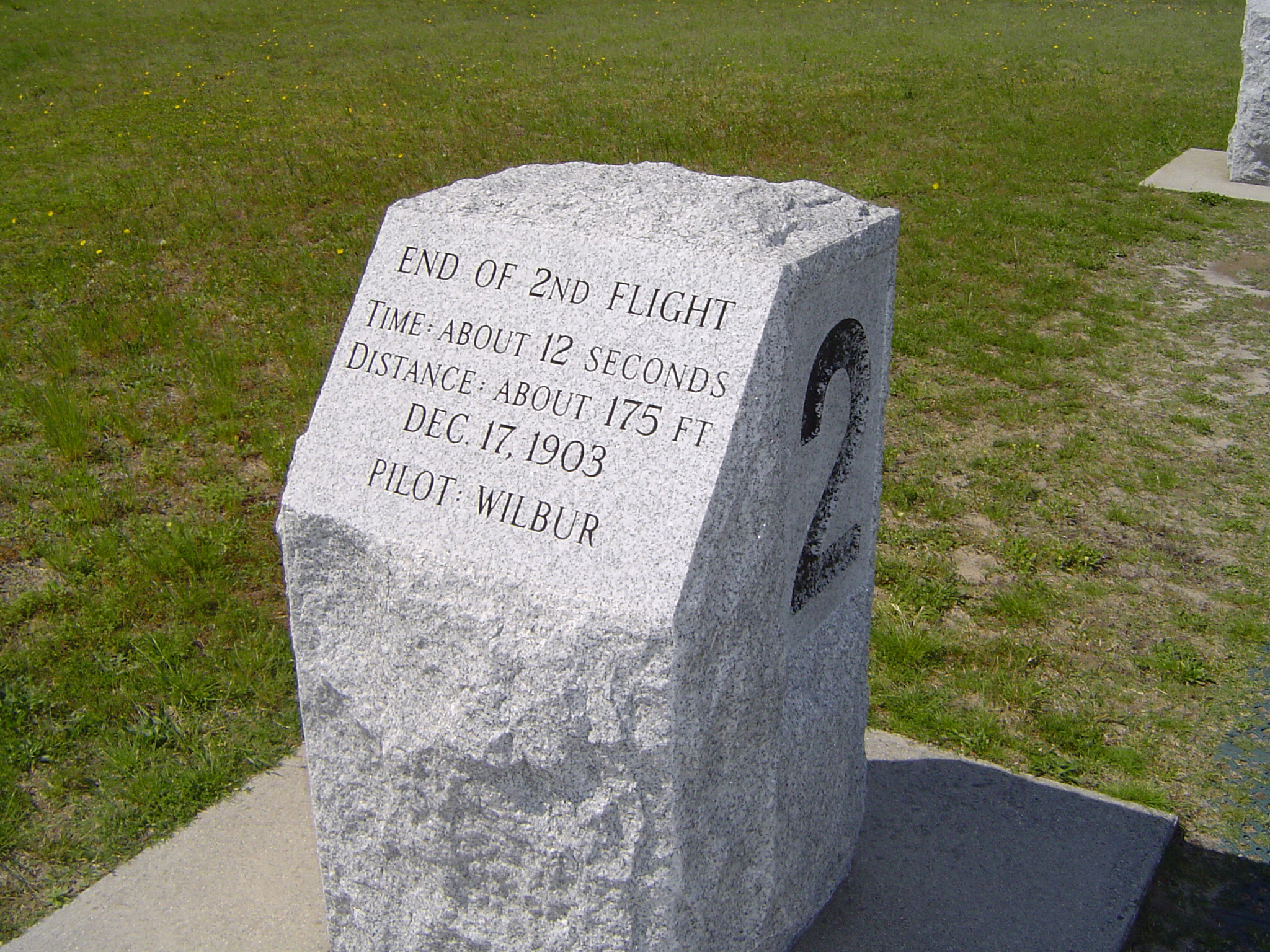 an image of Kitty Hawk Memorials commemorating the first flights undertaken by Orville and Wilbur Wright with the marker for the second flight pictured
