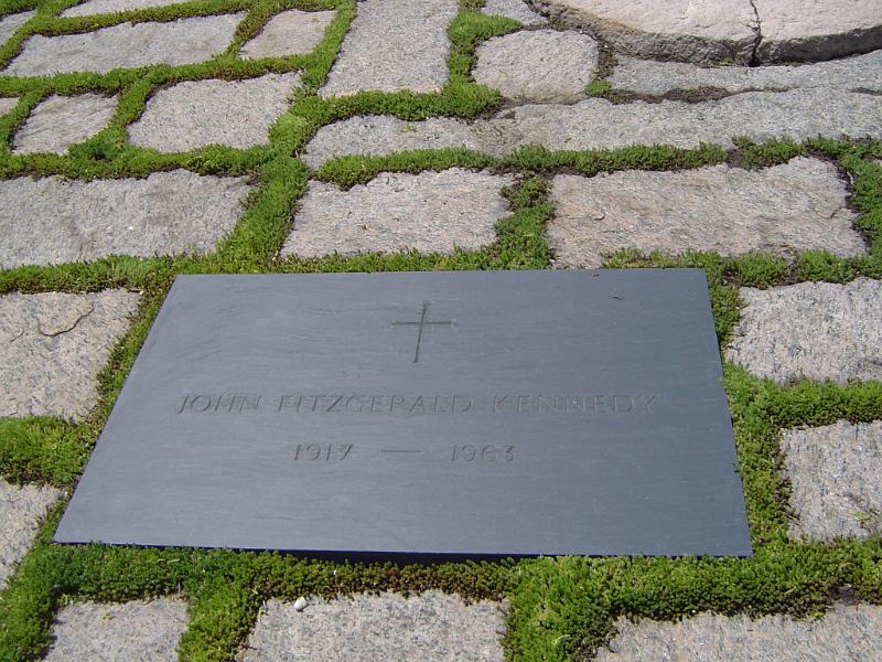 Memorial to John F Kennedy marking the place he was shot with a metal plaque in paving stones