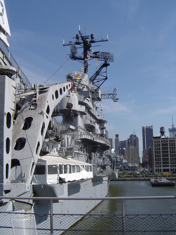 Vintage Huge Gray Naval Ship on Water Isolated on Light Blue Sky Background.