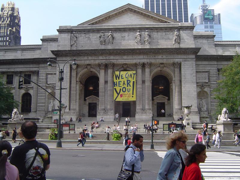 Random People Passing In Front Old Vintage New York Public Library Building on Street Side. Captured Front View.