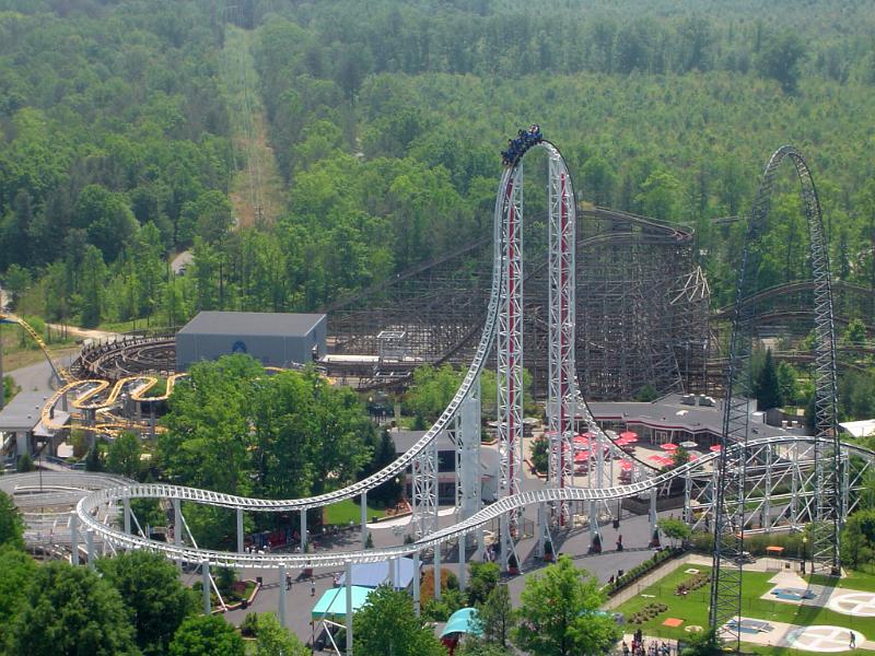 Aerial view of a rollercoaster ride in a USA themepark or amusement park showing a carriage at the pinnacle of the ride for thrill seekers