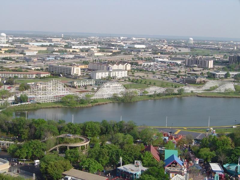 Landscaped theme park with a Roller Coaster ride laid out around a picturesque lake in America