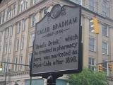 Close up Historic Caleb Bradham of Pepsi Cola Signage. Isolated on Huge Mediterranean Building.