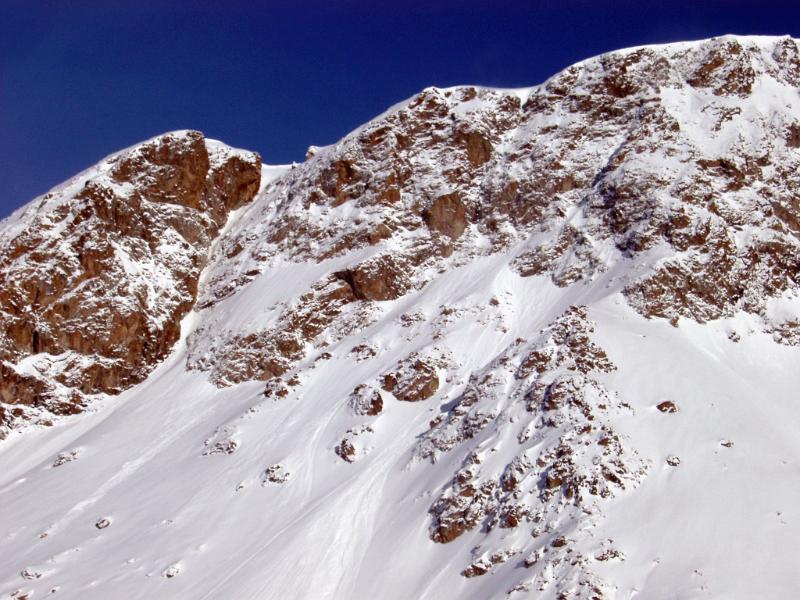 Huge Mountains Covered with Snow on Blue Sky Background During Winter Season.