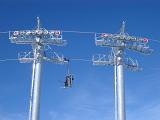 Empty Cable Cars on Light Blue Sky Background.